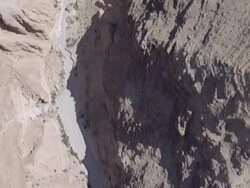 Aerial the Treasure Cave at Wadi Mishmar, running east towards the Dead Sea, Israel, Judea Desert Stock Footage