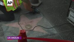 Workers sanded and swept away graffiti that was written on Bill Cosby's Walk of Fame star on Friday. (Dec. 5) Instructional Video