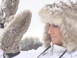 HD SUPER SLOW-MO: Woman Defending From Snowballs Stock Footage