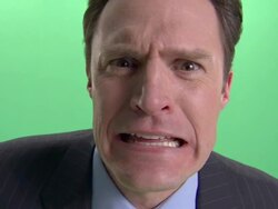 ECU, Terrified businessman making face into camera in studio Stock Footage