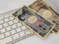 Falling on the keyboard of the Japanese Yen Stock Footage