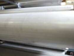 CU PAN Length of pipes being manufactured in industrial warehouse / Seattle, Washington, United States Stock Footage