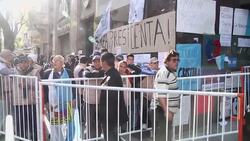 +4:3 People wait for news outside hospital where President Fernandez had brain surgery News Clip