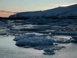 WS Melting glaciers floating on jokulsarlon lake at sunset / Iceland Stock Footage
