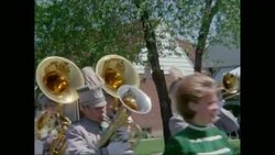 MS Performers marching in parade on street during carnival / United States Stock Footage