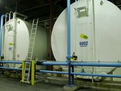 Big tanks of unknown liquid and pipes around Stock Footage