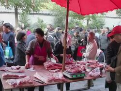 MS Assortment of food and shoppers in street market/xian,shaanxi,China Stock Footage