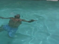 Man swims by Stock Footage