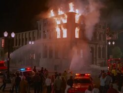 WS Fire fighters putting at burning building at night / Unspecified Stock Footage