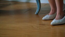 A child walks in high heel shoes. Stock Footage