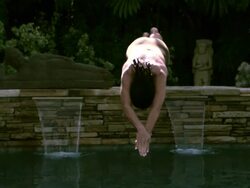 SLO MO WS TD Woman diving into swimming pool, splashing water/ California, USA Stock Footage