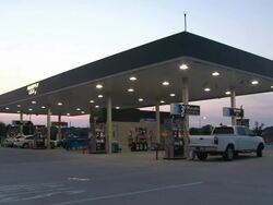 Medium Long Shot static - LED lamps illuminate a gas station /  Wisconsin, United States Stock Footage