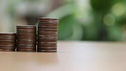 Coin stack on wooden floor in concept Business investment. Stock Footage