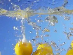 Oranges Splashing Into Water (Super Slow Motion) Stock Footage