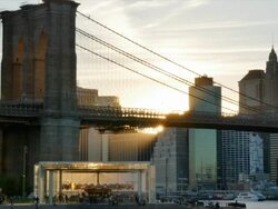 Brooklyn Bridge and Manhattan skyline at sunset. Stock Footage