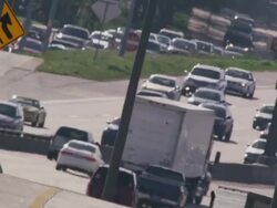 Long lens, overhead, huge traffic congestion on hot interstate highway. Stock Footage