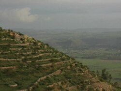 Green hill with stone enclosures Stock Footage