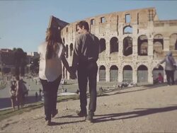 Couple in front of the Coliseum, hand in hand Stock Footage