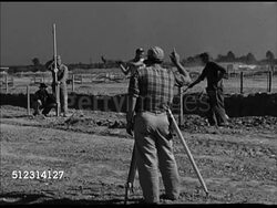 1947: CONSTRUCTION SITE: VS Construction site w/ tractor driving, workers surveying land, male operating leveling instrument, crane scooping, construction beams, designers looking over blueprints, crane raising beam. OH Instructional Video