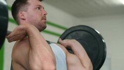 Strong man lifting weights at the gym Stock Footage