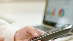 LD Male business man typing the numbers into the phone Stock Footage