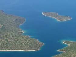 WS AERIAL View of unknown islands and aquaculture with open water / Ionian Islands, Greece Stock Footage
