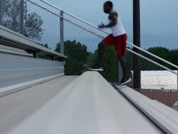 MS Young man working out and exercising on  set of bleachers near  field at dusk / Minneapolis, Minnesota, United States Stock Footage
