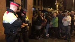 Crowds cheer as Catalan regional police officers leave school Instructional Video