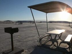MS PAN Picnic shelters in White Sands National Monument at sunset / Alamogordo, New Mexico, United States Stock Footage