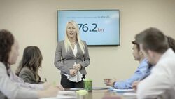 Adult female leader presenting business ideas to her team Stock Footage