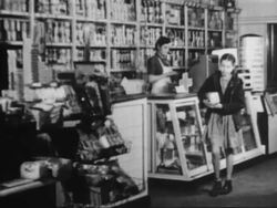 Man tries to use counterfeit money in general store Stock Footage