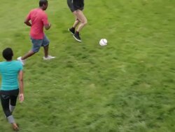 MS PAN Woman and two men playing soccer on lawn / Portland, Oregon, United States Stock Footage