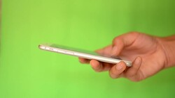 Smartphone touchscreen on green screen Stock Footage