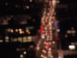Aerial view traffic on Oxford Street at night coming into focus / London, England Stock Footage