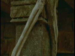 Tilt up CU Hindu Temple to tree roots growing around it, Bandhavgarh National Park, India Stock Footage