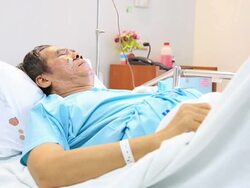 HD Tilt up crane shot: Patient in Hospital Stock Footage