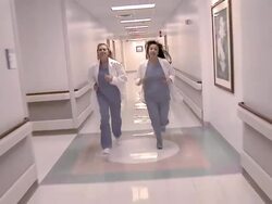 Two Female doctors running in hall Stock Footage