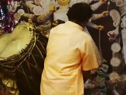 MS Shot of man playing dhol during durga puja festival / Gurgaon, Haryana, India Stock Footage