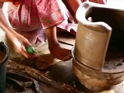 Senior Asian woman polishing a handmade pottery Stock Footage