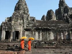 Cambodian monks walking at Bayon Angkor Thom Stock Footage