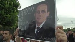 Protesters call for the release of journalist who posted link to Al Qaeda video News Clip