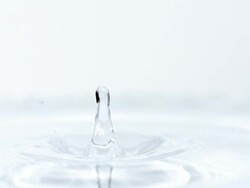  MS  SLO MO View of droplet Falling into Water / Vieux pont en auge, Normandy, France Stock Footage