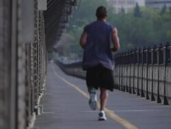man runs on a bridge Stock Footage