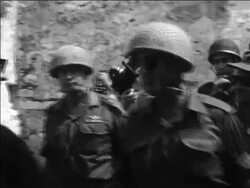 B/W 1967 Moshe Dayan in uniform + soldiers walking past Wailing Wall after Six Day War / Israel Stock Footage