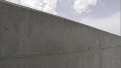 Seams show on the concrete wall of a levee. Stock Footage