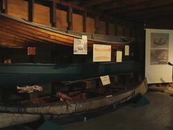 Demonstration of old canoes in a museum Stock Footage