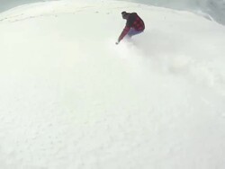 A snowboarder carving a mountain in winter. - Model Released - HD Stock Footage