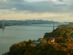 Aerial flying next to Hudson River, NYC skyline in distance Stock Footage