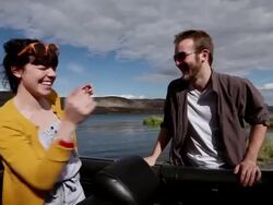 MS Woman kneeling in front seat boyfriend running up to playfully nudge girlfriend/Washington, USA  Stock Footage