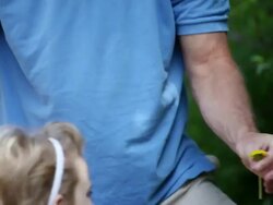 MS Little girl gives dandelion to her father  / Toronto, Ontario, Canada Stock Footage